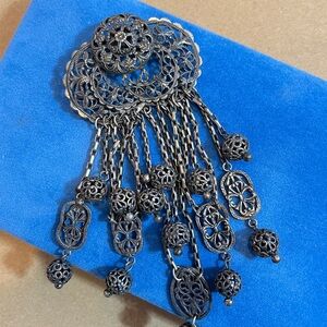 Elegant Black Filigree Dangle brooch from early stage